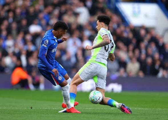 12th April 2026; Stamford Bridge, Chelsea, London, England: Premier League Football, Chelsea versus Manchester City; Estevao of Chelsea under pressure from Nico O Reilly of Manchester City JPxFletcher