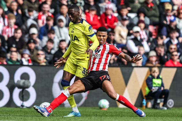 Premier League: Sunderland v Tottenham Hotspur Randal Kolo Muani of Tottenham Hotspur is tackled by Reinildo Mandava of Sunderland during the Premier League match Sunderland vs Tottenham Hotspur at Stadium Of Light, Sunderland, United Kingdom on 12 April 2026 (Photo by Alfie Cosgrove News Images) Sunderland Stadium Of Light Tyne and Wear United Kingdom Copyright: xAlfiexCosgrove NewsxImagesx