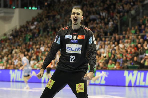 12.04.2026, xgox, Handball - Daikin HBL SC Magdeburg - HC Erlangen emspor, v.l. Matej Mandic (Magdeburg, 12) Jubelt ueber gehaltenen Ball, abgewehrt, gehalten, Torhueter Magdeburg