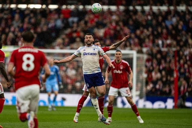 12th April 2026; The City Ground, Nottingham, England; Premier League Football, Nottingham Forest versus Aston Villa; John McGinn of Aston Villa wins a header from Neco Williams of Nottingham Forest GodfreyxPitt