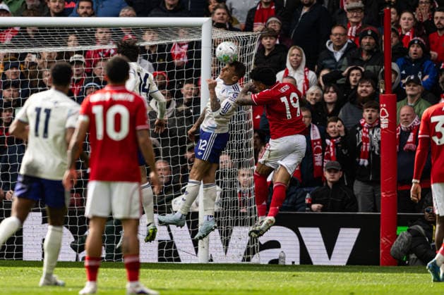 12th April 2026; The City Ground, Nottingham, England; Premier League Football, Nottingham Forest versus Aston Villa; Lucas Digne of Aston Villa makes a defensive clearance just ahead of Igor Jesus of Nottingham Forest GodfreyxPitt