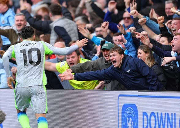12th April 2026; Stamford Bridge, Chelsea, London, England: Premier League Football, Chelsea versus Manchester City; Rayan Cherki of Manchester City celebrates towards the travelling Manchester City fans immediately after Marc Guehi of Manchester City scored his sides 2nd goal in the 57th minute to make it 2-0 JPxFletcher