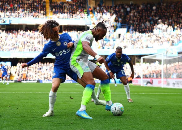12th April 2026; Stamford Bridge, Chelsea, London, England: Premier League Football, Chelsea versus Manchester City; Marc Cucurella of Chelsea challenges Antoine Semenyo of Manchester City JPxFletcher