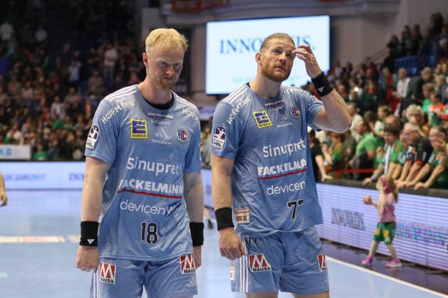 12.04.2026, xgox, Handball - Daikin HBL SC Magdeburg - HC Erlangen emspor, v.l. Sebastian Firnhaber (Erlangen, 18), Maciej Gebala (Erlangen, 77) enttaeuscht, schaut enttaeuscht, niedergeschlagen, disappointed Magdeburg