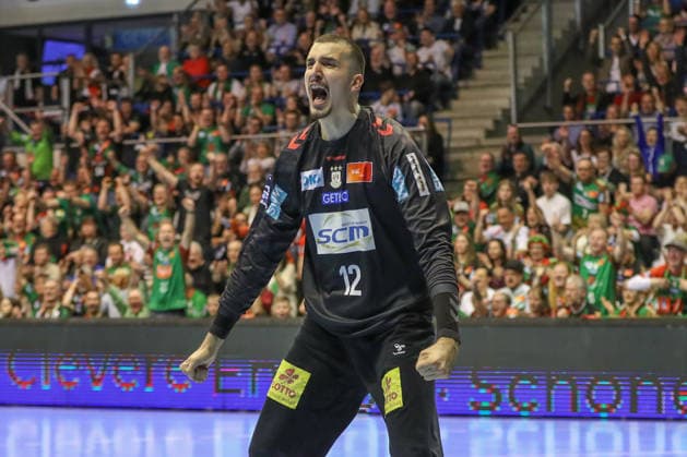 12.04.2026, xgox, Handball - Daikin HBL SC Magdeburg - HC Erlangen emspor, v.l. Matej Mandic (Magdeburg, 12) Jubelt ueber gehaltenen Ball, abgewehrt, gehalten, Torhueter Magdeburg