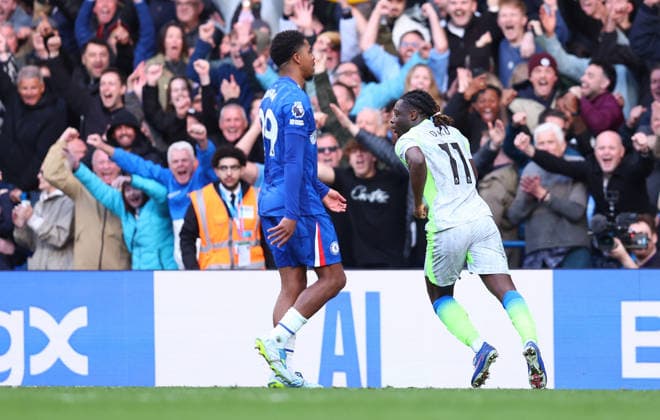 London, England, 12th April 2026. Jeremy Doku of Manchester City celebrates after scoring to make it 3-0 during the Chelsea vs Manchester City Premier League match at Stamford Bridge, London. Picture credit should read: Paul Terry Sportimage EDITORIAL USE ONLY. No use with unauthorised audio, video, data, fixture lists, club league logos or live services. Online in-match use limited to 120 images, no video emulation. No use in betting, games or single club league player publications. SPI_044_PT_Chelsea_Man_City SPI-4683-0044