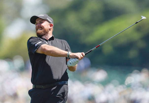 Shane Lowry of Ireland watches his approach shot on the 1st fairway during the final round of the Masters Tournament at Augusta National Golf Club on Sunday, April 12, 2026, in Augusta, Georgia.  AUG20260412810 JOHNxANGELILLO