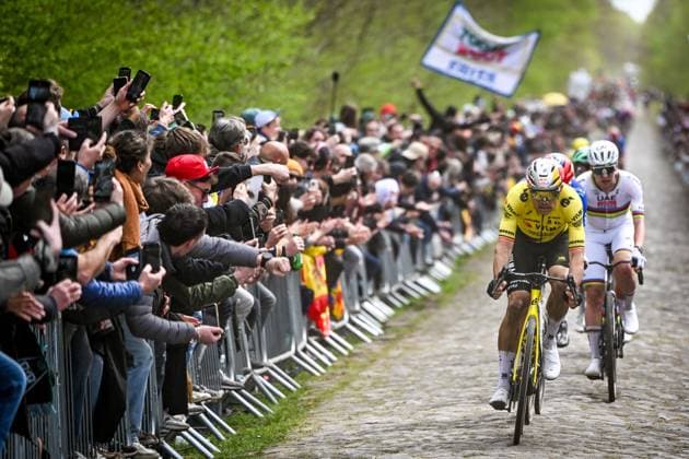 Belgian Wout van Aert of Team Visma-Lease a Bike and Slovenian Tadej Pogacar of UAE Team Emirates-XRG pictured in action during the men s Paris-Roubaix cycling race, Sunday 12 April 2026, around Roubaix, France. The 123rd edition of Paris-Roubaix cycling races will take on Sunday, with the women riding 143,1 km the men riding 258,3 km on Sunday. ELIASxROM  x170598473x