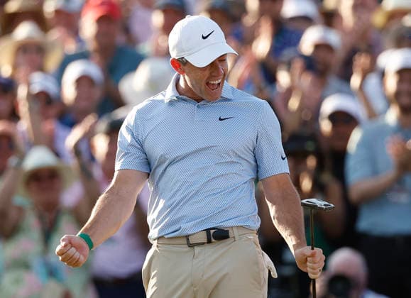 Rory McIlroy of Northern Ireland reacts on the 18th green after winning the Masters Tournament at Augusta National Golf Club on Sunday, April 12, 2026, in Augusta, Georgia. McIlroy won his second consecutive Masters with a 12-under-par four-day score of 276.  AUG20260412877 JOHNxANGELILLO