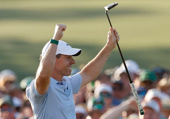 Rory McIlroy of Northern Ireland celebrates after winning the 2026 Masters Tournament at Augusta National Golf Club on Sunday, April 12, 2026, in Augusta, Georgia. McIlroy won his second consecutive Masters with a 12-under-par four-day score of 276.  AUG20260412887 JOHNxANGELILLO