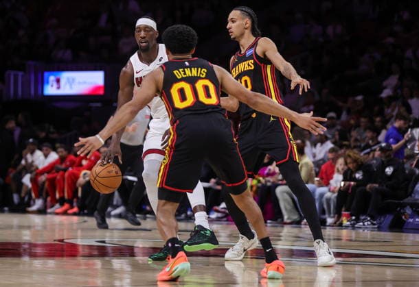 NBA, Basketball Herren, USA Miami Heat vs Atlanta Hawks game Miami Heat Center Forward Bam Adebayo (L) in action against Atlanta Hawks Guard RayJ Dennis (C) and Atlanta Hawks Forward Zaccharie Risacher during the NBA basketball game between the Miami Heat and the Atlanta Hawks at the Kaseya Center in Miami, Florida, USA, 12 April 2026. MIAMI FLORIDA United States  Copyright: xCRISTOBALxHERRERA-ULASHKEVICHx