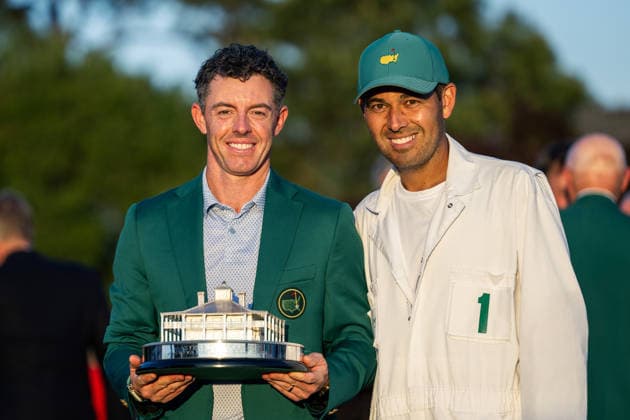 260412 Rory McIlroy of Northern Ireland pose with caddie Harry Diamond and the Masters trophy during the Green Jacket Ceremony after winning the final round of the 2026 Masters Golf Tournament on April 12, 2026 in Augusta. Photo: Petter Arvidson BILDBYRAN kod PA PA1196 golf masters bbeng the masters augusta jubel  Copyright: PETTERxARVIDSON BB260412PA284