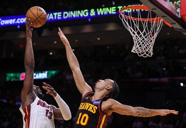 NBA, Basketball Herren, USA Miami Heat vs Atlanta Hawks game Miami Heat Center Forward Bam Adebayo (L) in action against Atlanta Hawks Forward Zaccharie Risacher during the NBA basketball game between the Miami Heat and the Atlanta Hawks at the Kaseya Center in Miami, Florida, USA, 12 April 2026. MIAMI FLORIDA United States  Copyright: xCRISTOBALxHERRERA-ULASHKEVICHx
