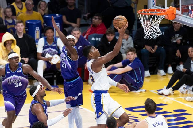 April 12, 2026, Los Angeles, California, USA: Los Angeles LakersÃ¢â‚¬â ¢ Rui Hachimura (28) goes past Utah JazzÃ¢â‚¬â ¢ Bez Mbeng (21) to the basket during an NBA, Basketball Herren, USA basketball game at Crypto.com Arena on Sunday, April 12, 2026 in Los Angeles. NBA 2026: Jazz Vs Lakers  - ZUMAc68_ 20260412_zaf_c68_013 Copyright: xRingoxChiux