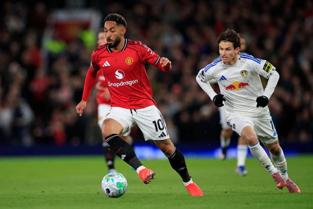 Manchester United, ManU v Leeds United, Premier League Matheus Cunha (10) of Manchester United runs past Brenden Aaronson (11) of Leeds United during the Premier League match between Manchester United and Leeds United at Old Trafford, Manchester, UK on 13 April 2026. Manchester Old Trafford Greater Manchester UK Editorial use only DataCo restrictions apply See www.football-dataco.com , Copyright: xConorxMolloyx PSI-24063-0048