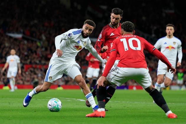 Manchester United, ManU v Leeds United, Premier League Jayden Bogle (2) of Leeds United controls the ball watched by Bruno Fernandes (8) of Manchester United during the Premier League match between Manchester United and Leeds United at Old Trafford, Manchester, UK on 13 April 2026. Manchester Old Trafford Greater Manchester UK Editorial use only DataCo restrictions apply See www.football-dataco.com , Copyright: xConorxMolloyx PSI-24063-0053