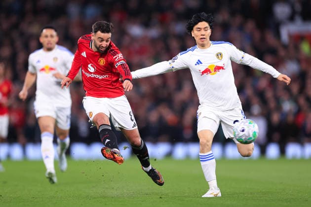 Football - Premier League - Manchester United, ManU v Leeds United 13th April 2026 - Premier League - Manchester United v Leeds United - Bruno Fernandes of Manchester United battles with Ao Tanaka of Leeds United - Photo: Simon Stacpoole Offside. Manchester UK Copyright: xSimonxStacpoolexOffside