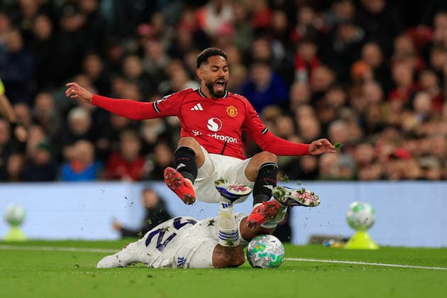 Manchester United, ManU v Leeds United, Premier League Matheus Cunha (10) of Manchester United is fouled by James Justin (24) of Leeds United during the Premier League match between Manchester United and Leeds United at Old Trafford, Manchester, UK on 13 April 2026. Manchester Old Trafford Greater Manchester UK Editorial use only DataCo restrictions apply See www.football-dataco.com , Copyright: xConorxMolloyx PSI-24063-0054