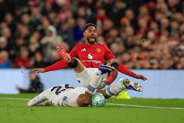 Manchester United, ManU v Leeds United, Premier League Matheus Cunha (10) of Manchester United is fouled by James Justin (24) of Leeds United during the Premier League match between Manchester United and Leeds United at Old Trafford, Manchester, UK on 13 April 2026. Manchester Old Trafford Greater Manchester UK Editorial use only DataCo restrictions apply See www.football-dataco.com , Copyright: xConorxMolloyx PSI-24063-0055