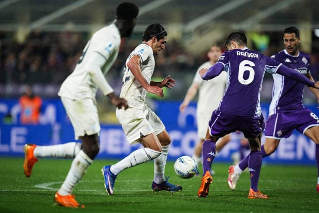 Lazio s Matteo Cancellieri fights for the ball with FiorentinaÕs Luca Ranieri during the Serie A soccer match between Fiorentina and Lazio at the Artemio Franchi Stadium in Florence, north Italy - Monday, April 13, 2026 -  Copyright: xMassimoxPaolone LaPressex