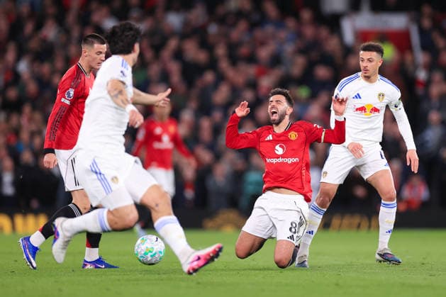 Football - Premier League - Manchester United, ManU v Leeds United 13th April 2026 - Premier League - Manchester United v Leeds United - Bruno Fernandes of Manchester United screams as he goes down under a challenge from Ethan Ampadu of Leeds United - Photo: Simon Stacpoole Offside. Manchester UK Copyright: xSimonxStacpoolexOffside