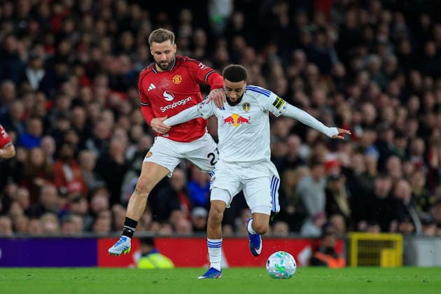 Manchester United, ManU v Leeds United, Premier League Luke Shaw (23) of Manchester United gets a yellow card for holding back Jayden Bogle (2) of Leeds United during the Premier League match between Manchester United and Leeds United at Old Trafford, Manchester, UK on 13 April 2026. Manchester Old Trafford Greater Manchester UK Editorial use only DataCo restrictions apply See www.football-dataco.com , Copyright: xConorxMolloyx PSI-24063-0066