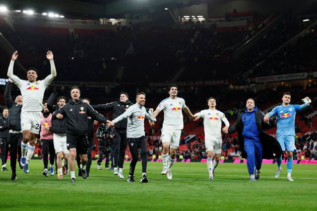 Manchester United, ManU v Leeds United - Premier League James Justin, Pascal Struijk, Ethan Ampadu and Karl Darlow of Leeds United celebrate after winning the Premier League match between Manchester United and Leeds United at Old Trafford on April 13, 2026 in Manchester, England. WARNING! This Photograph May Only Be Used For Newspaper And Or Magazine Editorial Purposes. May Not Be Used For Publications Involving 1 player, 1 Club Or 1 Competition Without Written Authorisation From Football DataCo Ltd. For Any Queries, Please Contact Football DataCo Ltd on +44 (0) 207 864 9121 Manchester Old Trafford England United Kingdom Copyright: xAllstarxPicturexLibraryxLtdx