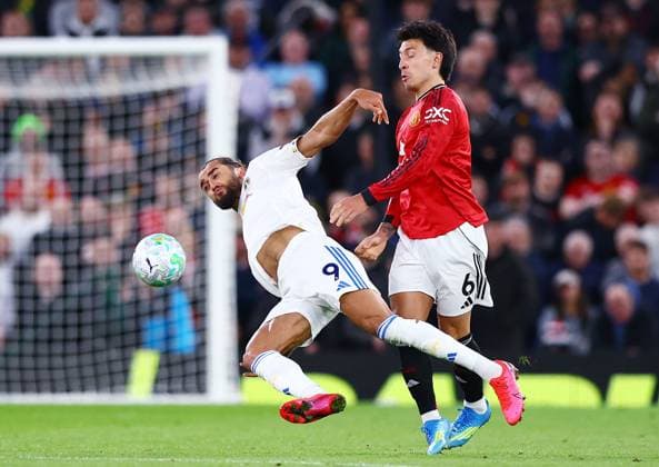 Dominic Calvert-Lewin of Leeds United and Lisandro Martinez of Manchester United, ManU Manchester United v Leeds United, Premier League, Football, Old Trafford, Manchester, UK - 13 Apr 2026Manchester Old Trafford United Kingdom EDITORIAL USE ONLY No use with unauthorised audio, video, data, fixture lists, club league logos or live services. Online in-match use limited to 120 images, no video emulation. No use in betting, games or single club league player publications.  Copyright: xMattxWest Shutterstockx 16827177bh