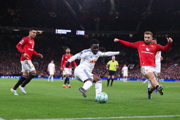 Football - Premier League - Manchester United, ManU v Leeds United 13th April 2026 - Premier League - Manchester United v Leeds United - Wilfried Gnonto of Leeds United in action with Luke Shaw of Manchester United - Photo: Simon Stacpoole Offside. Manchester UK Copyright: xSimonxStacpoolexOffside