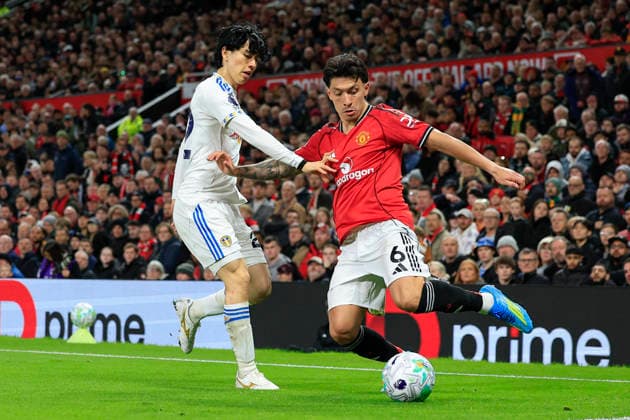 Manchester United, ManU v Leeds United, Premier League Lisandro Martinez (6) of Manchester United is challenged by Ao Tanaka (22) of Leeds United during the Premier League match between Manchester United and Leeds United at Old Trafford, Manchester, UK on 13 April 2026. Manchester Old Trafford Greater Manchester UK Editorial use only DataCo restrictions apply See www.football-dataco.com , Copyright: xConorxMolloyx PSI-24063-0118