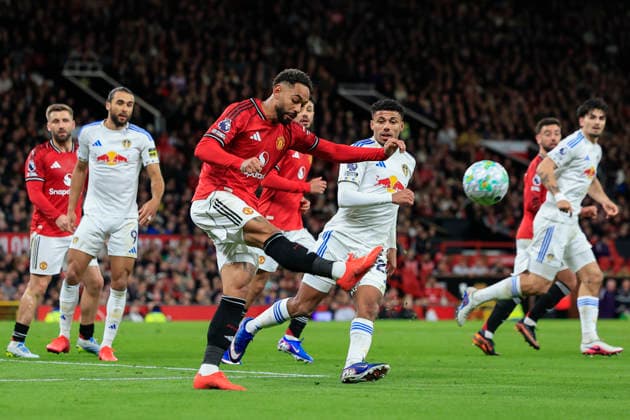 Manchester United, ManU v Leeds United, Premier League Matheus Cunha (10) of Manchester United clears the ball upfield during the Premier League match between Manchester United and Leeds United at Old Trafford, Manchester, UK on 13 April 2026. Manchester Old Trafford Greater Manchester UK Editorial use only DataCo restrictions apply See www.football-dataco.com , Copyright: xConorxMolloyx PSI-24063-0120