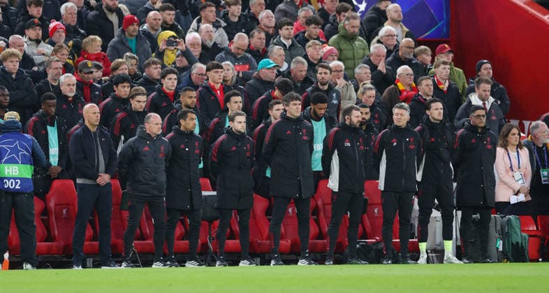 Liverpool, England, 14th April 2026. Arne Slot manager of Liverpool (l) takes part in a minutes silence to remember those that died during the Hillsborough disaster during the Liverpool vs Paris Saint Germain UEFA Champions League quarter final 2nd leg match at Anfield, Liverpool. Picture credit should read: Jessica Hornby Sportimage EDITORIAL USE ONLY. No use with unauthorised audio, video, data, fixture lists, club league logos or live services. Online in-match use limited to 120 images, no video emulation. No use in betting, games or single club league player publications. SPI_052_JH_Liverpool_PSG SPI-4687-0051