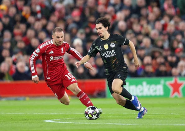 Liverpool, England, 14th April 2026. Alexis Mac Allister of Liverpool tussles with Vitinha of Paris Saint-Germain during the Liverpool vs Paris Saint Germain UEFA Champions League quarter final 2nd leg match at Anfield, Liverpool. Picture credit should read: Jessica Hornby Sportimage EDITORIAL USE ONLY. No use with unauthorised audio, video, data, fixture lists, club league logos or live services. Online in-match use limited to 120 images, no video emulation. No use in betting, games or single club league player publications. SPI_053_JH_Liverpool_PSG SPI-4687-0052