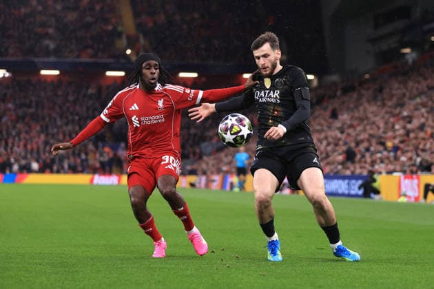 Liverpool v Paris Saint-Germain 14th April 2026 - UEFA Champions League - Quarter Final (2nd Leg) - Liverpool v Paris Saint-Germain - Jeremie Frimpong of Liverpool and Khvicha Kvaratskhelia of PSG - Photo: Simon Stacpoole Offside. Liverpool UK Copyright: xSimonxStacpoolexOffside