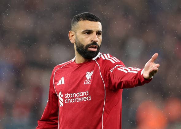 Liverpool, England, 14th April 2026. Mohamed Salah of Liverpool gestures during the Liverpool vs Paris Saint Germain UEFA Champions League quarter final 2nd leg match at Anfield, Liverpool. Picture credit should read: Jessica Hornby Sportimage EDITORIAL USE ONLY. No use with unauthorised audio, video, data, fixture lists, club league logos or live services. Online in-match use limited to 120 images, no video emulation. No use in betting, games or single club league player publications. SPI_071_JH_Liverpool_PSG SPI-4687-0071