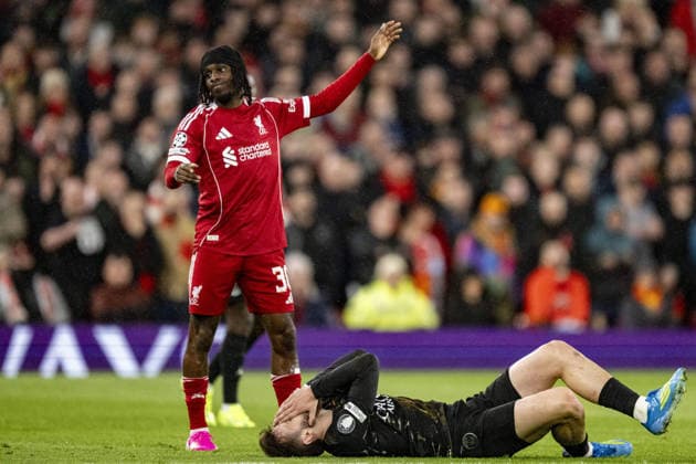 Liverpool v Paris Saint-Germain - UEFA Champions League 2025 26 LIVERPOOL, ENGLAND- APRIL 14: Jeremie Frimpong of Liverpool gestures with Khvicha Kvaratskhelia of Paris Saint-Germain reacting during a UEFA Champions League 2025 26 match between Liverpool and Paris Saint-Germain in Liverpool on April 14, 2026 (Photo by Will Palmer Sports Press Photo) LiverpoolUnited Kingdom  Copyright: xWillxPalmer SportsxPressxPhotox