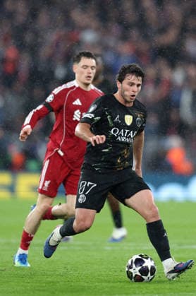 Liverpool, England, 14th April 2026. Joao Neves of Paris St Germain moves ahead of Florian Wirtz of Liverpool during the Liverpool vs Paris Saint Germain UEFA Champions League quarter final 2nd leg match at Anfield, Liverpool. Picture credit should read: Jessica Hornby Sportimage EDITORIAL USE ONLY. No use with unauthorised audio, video, data, fixture lists, club league logos or live services. Online in-match use limited to 120 images, no video emulation. No use in betting, games or single club league player publications. SPI_072_JH_Liverpool_PSG SPI-4687-0072