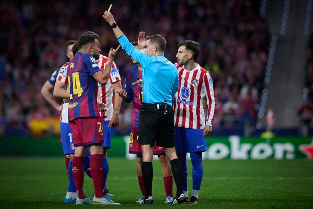 Atletico de Madrid v FC Barcelona, Barca - UEFA Champions League 2025 2026 - Quarter-final, 2nd leg Referee Clement Turpin (c) shows yellow card to FC Barcelona™s Eric Garcia during Champions League 2025 2026, quarter-final, 2nd leg, April 14 ,2026. (ALTERPHOTOS Ropero) MadridSpain  Copyright: xRoperox