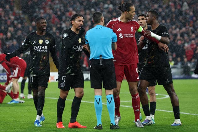 RECORD DATE NOT STATED 14th April 2026; Anfield, Liverpool, Merseyside, England; UEFA Champions League Football, Liverpool versus Paris Saint Germain; Marquinhos of Paris Saint Germain protests to referee Maurizio Mariani after his initial decision to award a penalty DavidxBlunsden