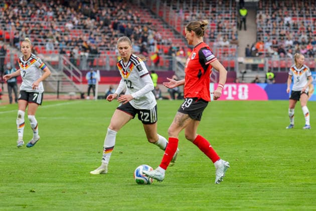 14.04.2026, xgrfx, Fussball WM Qualifikation Frauen , Deutschland - Österreich v.l. Jule Brand (Deutsche Frauennationalmannschaft), Verena Hanshaw (Österreich) (DFL DFB REGULATIONS PROHIBIT ANY USE OF PHOTOGRAPHS as IMAGE SEQUENCES and or QUASI-VIDEO) Nürnberg