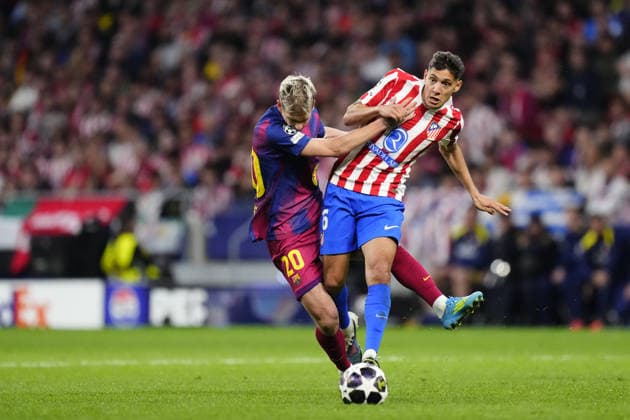 Atletico Madrid v FC Barcelona, Barca - UEFA Champions League MADRID, SPAIN - APRIL 14: Dani Olmo attacking midfield of Barcelona and Spain and Nahuel Molina right-back of Atletico de Madrid and Argentina compete for the ball during the UEFA Champions League 2025 26 Quarter-Final Second Leg match between Club Atlético de Madrid and FC Barcelona at Estadio Riyadh Air Metropolitano on April 14, 2026 in Madrid, Spain. Jose Hernandez Anadolu Madrid Spain. Editorial use only. Please get in touch for any other usage.  Copyright: x2026xAnadoluxJosexHernandezx