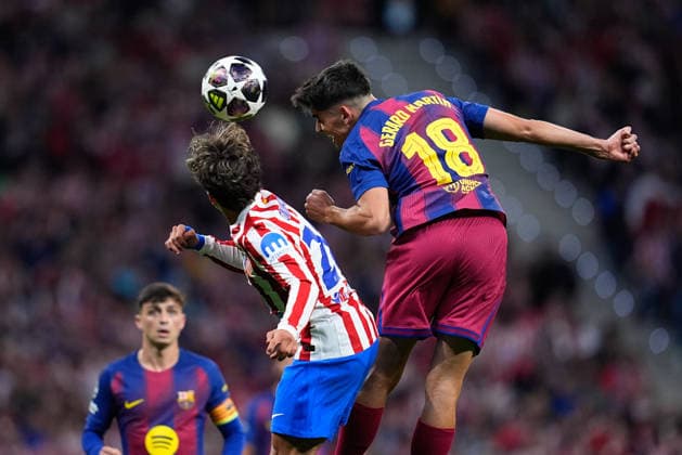 April 14, 2026, Madrid, Madrid, Spain: Gerard Martin of FC Barcelona, Barca and Giuliano Simeone of Atletico de Madrid compete for the ball during the UEFA Champions League 2025 26 Quarter-Final Second Leg match between Atletico de Madrid and FC Barcelona at Riyadh Air Metropolitano on April 14, 2026, in Madrid, Spain. Madrid Spain - ZUMAa181 20260414_zaa_a181_344 Copyright: xDennisxAgyemanx