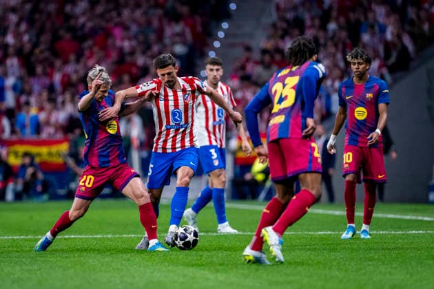 Atletico de Madrid v FC Barcelona, Barca - UEFA Champions League 2025 26 Quarter-Final Second Leg MADRID, SPAIN - APRIL 14: Clement Lenglet of Atletico de Madrid (R) is in action with the ball defended by Dani Olmo of FC Barcelona (L) during the UEFA Champions League 2025 26 Quarter-Final Second Leg match between Atletico de Madrid and FC Barcelona at Estadio Riyadh Air Metropolitano on April 14, 2026 in Madrid, Spain. (Photo by Alberto Gardin Eurasia Images Getty Images) Madrid Estadio Riyadh Air Metropolitano Spain Copyright: xEurasiaxSportxImagesx AGardin_20260414_Foot_Champ_Atl_Mad_Bar_169