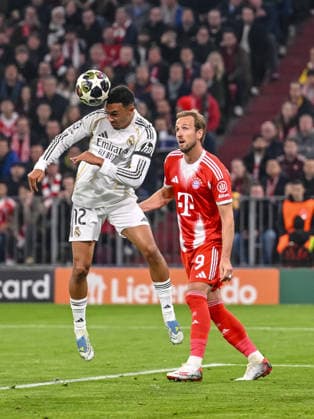 Trent Alexander-Arnold (Real Madrid) and Harry Kane (FC Bayern München) battle for the ball during the UEFA Champions League 2025 26 Quarter-Final Second Leg match between FC Bayern München and Real Madrid CF at Football Arena Munich on April 15, 2026 in Munich, Germany. (Photo by Harry Langer DeFodi Images) -