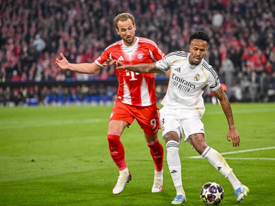 Harry Kane (FC Bayern München) and Eder Militae (Real Madrid) battle for the ball during the UEFA Champions League 2025 26 Quarter-Final Second Leg match between FC Bayern München and Real Madrid CF at Football Arena Munich on April 15, 2026 in Munich, Germany. (Photo by Harry Langer DeFodi Images) -