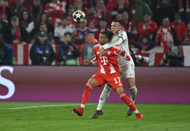 15.04.2026, xemx, Fussball UEFA Champions League, FC Bayern Muenchen - Real Madrid v.l. Michael Olise (FC Bayern Muenchen), Kylian Mbappe (Real Madrid) (DFL DFB REGULATIONS PROHIBIT ANY USE OF PHOTOGRAPHS as IMAGE SEQUENCES and or QUASI-VIDEO) Muenchen