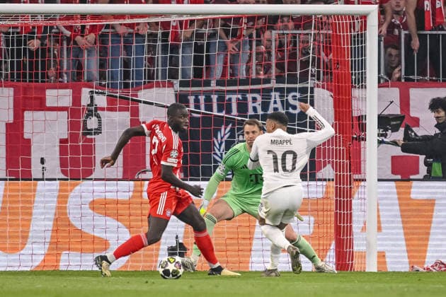 Dayot Upamecano (FC Bayern München), Torwart Manuel Neuer (FC Bayern München) and Kylian Mbappe (Real Madrid) battle for the ball during the UEFA Champions League 2025 26 Quarter-Final Second Leg match between FC Bayern München and Real Madrid CF at Football Arena Munich on April 15, 2026 in Munich, Germany. (Photo by Harry Langer DeFodi Images) -
