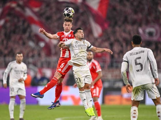 Joshua Kimmich (FC Bayern München) and Brahim Diaz (Real Madrid) battle for the ball during the UEFA Champions League 2025 26 Quarter-Final Second Leg match between FC Bayern München and Real Madrid CF at Football Arena Munich on April 15, 2026 in Munich, Germany. (Photo by Harry Langer DeFodi Images) -