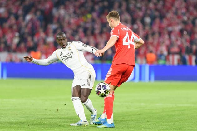 Bayern Munich v Real Madrid - UEFA Champions League 2025 26 MUNICH, GERMANY - APRIL 15: Ferland Mendy (23 Real Madrid) and Josip Stanisic (44 FC Bayern Munich) during a UEFA Champions League 2025 26 match between Bayern Munich and Real Madrid in Munich on April 15, 2026 (Photo by Sven Beyrich Sports Press Photo) Bayern Munich v Real Madrid - UEFA Champions League 2025 26