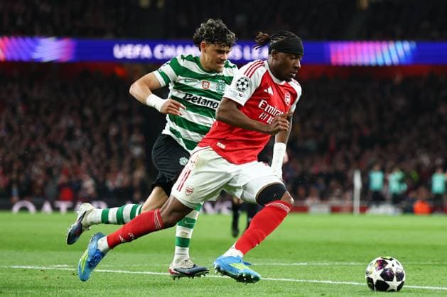 Noni Madueke of Arsenal chased by Maximiliano Araujo of Sporting CP Arsenal v Sporting, UEFA Champions League, Quarter Final, Second Leg, Football, Emirates Stadium, London, UK - 15 Apr 2026London Emirates Stadium United Kingdom EDITORIAL USE ONLY No use with unauthorised audio, video, data, fixture lists, club league logos or live services. Online in-match use limited to 120 images, no video emulation. No use in betting, games or single club league player publications. Copyright: xSimonxDael Shutterstockx 16828544bi